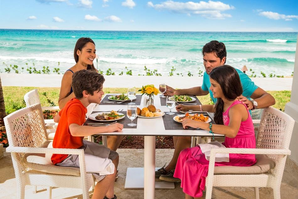 family of 4 eating dinner together